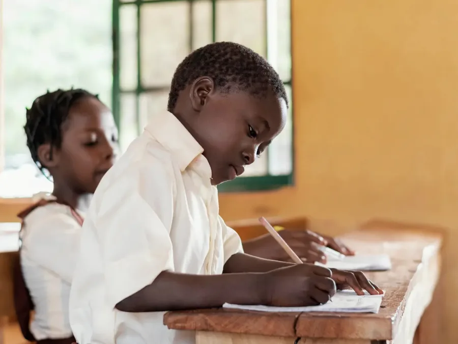 Cares tutor working one-on-one with a student at home