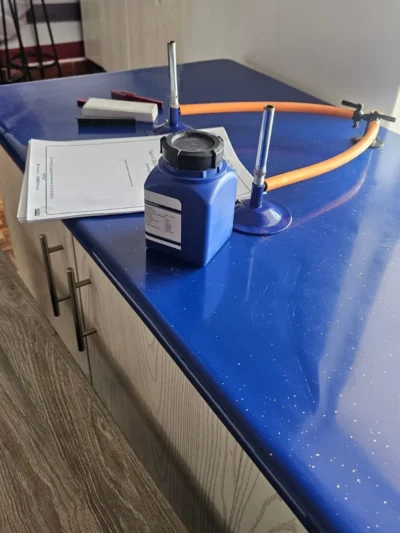 Chemistry practical setup with a reagent bottle and bunsen burner stand
