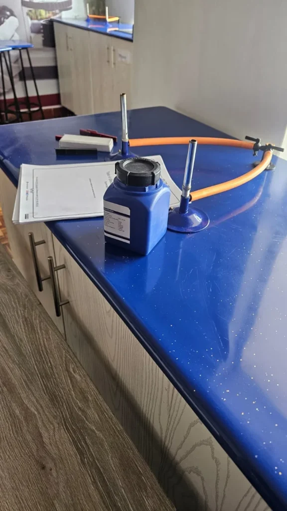 Chemistry practical setup with a reagent bottle and bunsen burner stand