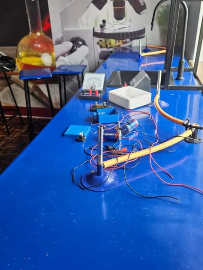 Physics and chemistry apparatus set up for a practical, with a conical flask, at Cares Home-based Tuition