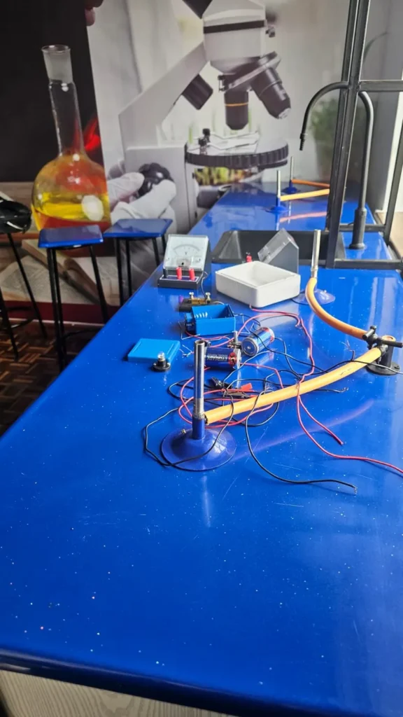 Physics and chemistry apparatus set up for a practical, with a conical flask, at Cares Home-based Tuition
